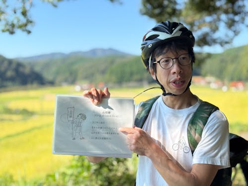 宮崎さんサイクリングツアーで酒米田んぼを案内