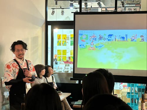 都内で取り組みのプレゼンをしている様子