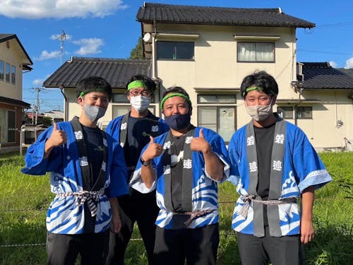 市役所担当者と地域の祭りに参加